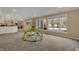 Open basement with a walkout to pool, a fireplace and carpet throughout at 13934 Salsbury Creek Dr, Carmel, IN 46032