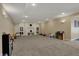 Finished basement with a built-in shelving area perfect for storage and decor at 13934 Salsbury Creek Dr, Carmel, IN 46032