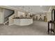 Finished basement area with a wet bar and views of the stairs to the floor above at 13934 Salsbury Creek Dr, Carmel, IN 46032