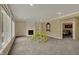 Spacious finished basement featuring a cozy fireplace and multiple windows at 13934 Salsbury Creek Dr, Carmel, IN 46032