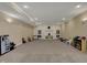 Spacious finished basement with built-in bookshelves and ample room for play at 13934 Salsbury Creek Dr, Carmel, IN 46032