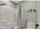 This cozy bathroom features a shower/tub combo and decorative shelves at 13934 Salsbury Creek Dr, Carmel, IN 46032