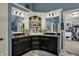 This bathroom offers a granite vanity, modern sinks, and a unique corner cabinet feature at 13934 Salsbury Creek Dr, Carmel, IN 46032