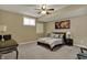 Cozy basement bedroom with a ceiling fan, carpeting, and a unique world map decor at 13934 Salsbury Creek Dr, Carmel, IN 46032