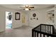 Cozy bedroom featuring a dark crib, ensuite, walk-in closet, and plush carpet at 13934 Salsbury Creek Dr, Carmel, IN 46032