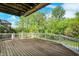 The spacious deck with white railing offers the perfect outdoor space for entertaining while enjoying scenic nature views at 13934 Salsbury Creek Dr, Carmel, IN 46032