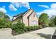 Charming brick home with a manicured lawn and vibrant landscaping, showcasing its curb appeal at 13934 Salsbury Creek Dr, Carmel, IN 46032