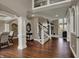Foyer with open staircase and wood floors at 13934 Salsbury Creek Dr, Carmel, IN 46032