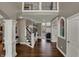Foyer with wood floors and a view to the living room at 13934 Salsbury Creek Dr, Carmel, IN 46032