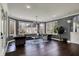 Bright living room featuring a large window, hardwood floors, and comfortable seating at 13934 Salsbury Creek Dr, Carmel, IN 46032