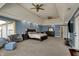 This expansive bedroom features recessed lighting, ceiling fans, and blue accent wall at 13934 Salsbury Creek Dr, Carmel, IN 46032