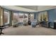 Bright sitting area in main bedroom featuring large windows and plush carpeting at 13934 Salsbury Creek Dr, Carmel, IN 46032