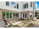 A concrete patio outside the home offers the perfect space to relax and enjoy the serene backyard views at 13934 Salsbury Creek Dr, Carmel, IN 46032