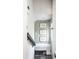 Inviting entryway features leaf-patterned wallpaper, framed botanical art, and a bench at 1451 N Grant Ave, Indianapolis, IN 46201