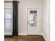 Entryway featuring a door with glass inserts and hardwood flooring at 1451 N Grant Ave, Indianapolis, IN 46201