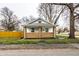 Charming brick home with a cozy front porch at 1451 N Grant Ave, Indianapolis, IN 46201
