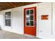 A close up of the front door with a window and modern mailbox at 1451 N Grant Ave, Indianapolis, IN 46201