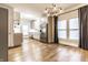 Bright, spacious kitchen with stainless steel appliances, modern lighting and beautiful hard wood floors at 1451 N Grant Ave, Indianapolis, IN 46201