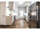 Well-lit kitchen features stainless steel appliances, hardwood flooring, and white subway tile backsplash at 1451 N Grant Ave, Indianapolis, IN 46201
