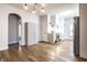 Modern kitchen with stainless steel appliances, hardwood floors and pantry storage at 1451 N Grant Ave, Indianapolis, IN 46201