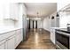 Spacious open kitchen with stainless steel appliances, hardwood flooring and dining area at 1451 N Grant Ave, Indianapolis, IN 46201