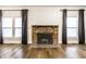 Living room with hardwood floors and fireplace at 1451 N Grant Ave, Indianapolis, IN 46201