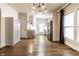 Open living room with hardwood floors, a fireplace, and kitchen view at 1451 N Grant Ave, Indianapolis, IN 46201