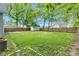 View of the spacious backyard featuring a grassy lawn, wooden fence and storage shed at 1508 Monument St, Noblesville, IN 46060