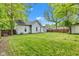 View of back exterior with lawn and trees on a sunny day at 1508 Monument St, Noblesville, IN 46060