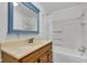 Bathroom featuring a wood vanity, framed mirror, toilet, and shower with curtain at 1508 Monument St, Noblesville, IN 46060
