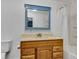 Bathroom featuring a wood vanity, framed mirror, toilet, and shower with curtain at 1508 Monument St, Noblesville, IN 46060