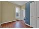Bedroom featuring laminate flooring, and a window with a street view and bathroom access at 1508 Monument St, Noblesville, IN 46060