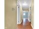 Bright hallway with hardwood floors that leads to other rooms in the home at 1508 Monument St, Noblesville, IN 46060