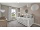 Charming bedroom featuring a cozy daybed, stylish wallpaper, and eye-catching pendant lighting at 15334 Swallow Falls Way, Fishers, IN 46037