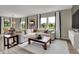 Bright and airy living room with large windows, plush seating, and stylish accents at 15334 Swallow Falls Way, Fishers, IN 46037