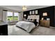 Inviting primary bedroom with a large bed, stylish furnishings, and plenty of natural light at 15334 Swallow Falls Way, Fishers, IN 46037