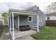 The exterior boasts a covered porch and an expansive backyard, perfect for outdoor enjoyment at 1643 E Tabor St, Indianapolis, IN 46203