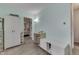 The room has storage, wood floors, and access to another room at 1643 E Tabor St, Indianapolis, IN 46203
