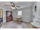 Cozy dining area features a classic hutch for storage and a ceiling fan to keep the space cool at 1643 E Tabor St, Indianapolis, IN 46203