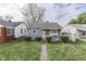 Modest single-story home with tidy landscaping and a walkway leading to the front door at 1643 E Tabor St, Indianapolis, IN 46203