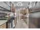 An efficient kitchen featuring stainless steel appliances and ample cabinet space at 1643 E Tabor St, Indianapolis, IN 46203