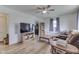 Cozy living room featuring hardwood floors, a ceiling fan, and a comfortable seating area at 1643 E Tabor St, Indianapolis, IN 46203