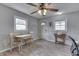 Inviting living room featuring a small dining area, neutral paint, and ample natural light at 1643 E Tabor St, Indianapolis, IN 46203