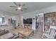 Spacious living room with hardwood floors, TV, and furniture at 1643 E Tabor St, Indianapolis, IN 46203