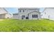 Spacious backyard with lush green grass and patio space, perfect for outdoor enjoyment at 192 Lynnette Way, Cumberland, IN 46229