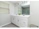 Bright bathroom featuring a double sink vanity, white cabinets, and tiled floor at 192 Lynnette Way, Cumberland, IN 46229