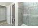 Updated bathroom with a glass-enclosed shower with gray tile and a separate toilet room at 192 Lynnette Way, Cumberland, IN 46229