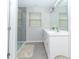 Well-lit bathroom with a double vanity, framed mirror and walk-in glass shower at 192 Lynnette Way, Cumberland, IN 46229