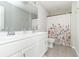 Bright bathroom with a double vanity, white cabinets and a shower at 192 Lynnette Way, Cumberland, IN 46229