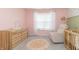 Adorable Bedroom featuring a changing table and a comfortable armchair at 192 Lynnette Way, Cumberland, IN 46229